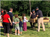 Kids in line to play a game with police officers