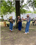 3 brass musicians in overalls and straw hats