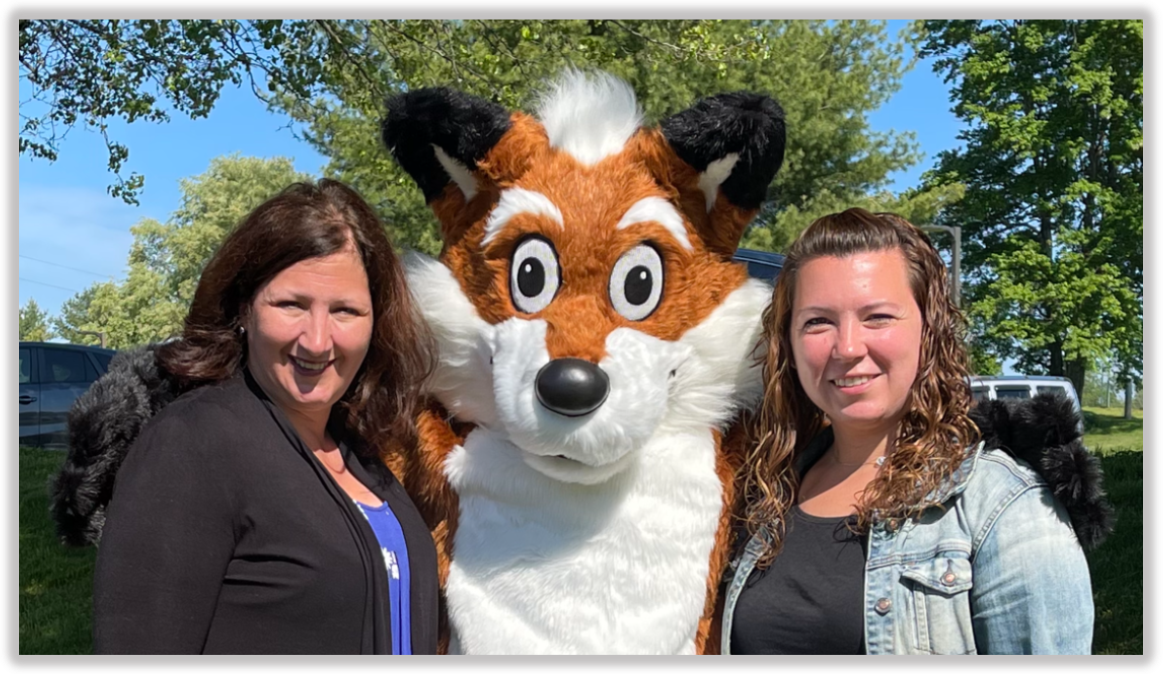 Karin and Randi and Foxy, the department mascot, a costumed person