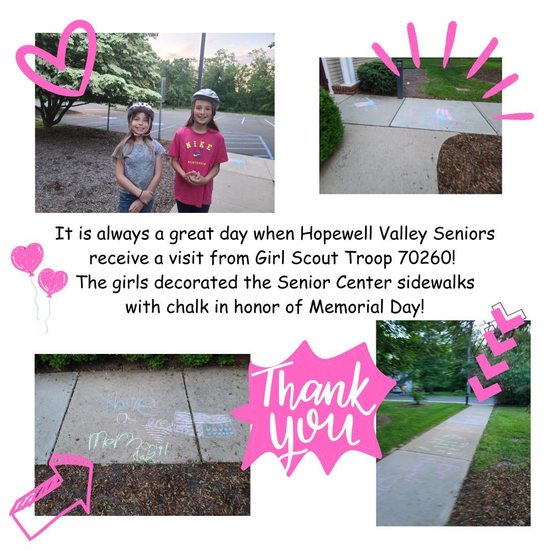 Girl Scouts decorate the sidewalks of the senior center for Memorial Day