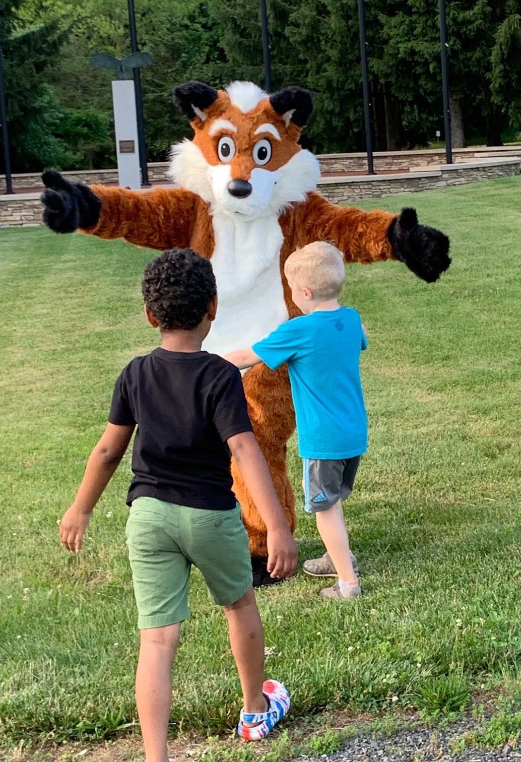 Children in front of fox mascot