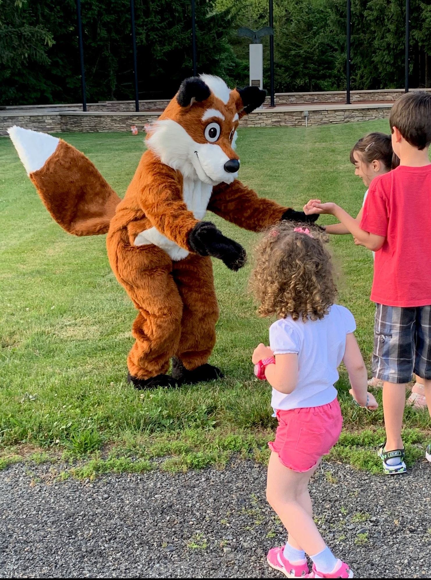 Children in front of fox mascot