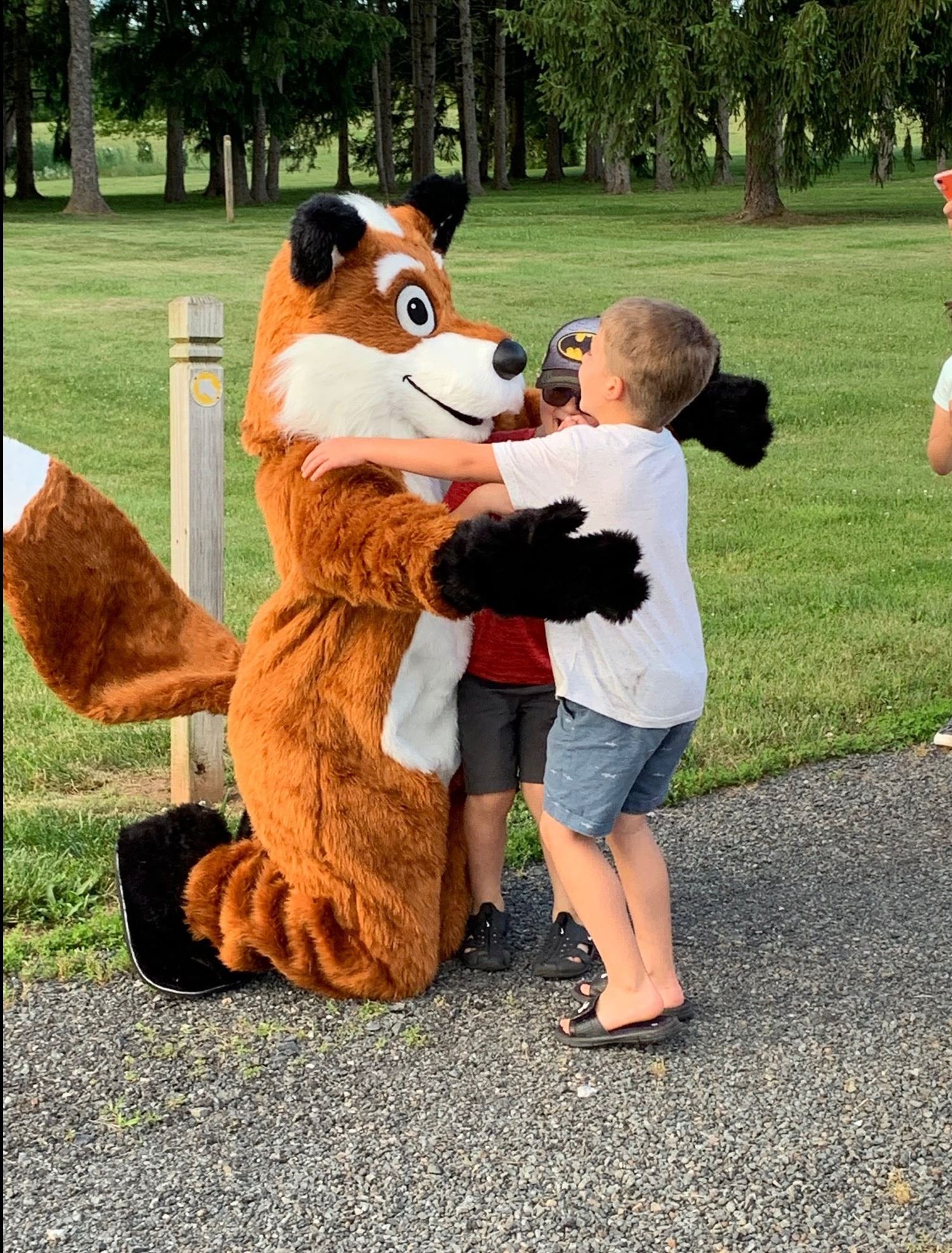 Children in front of fox mascot