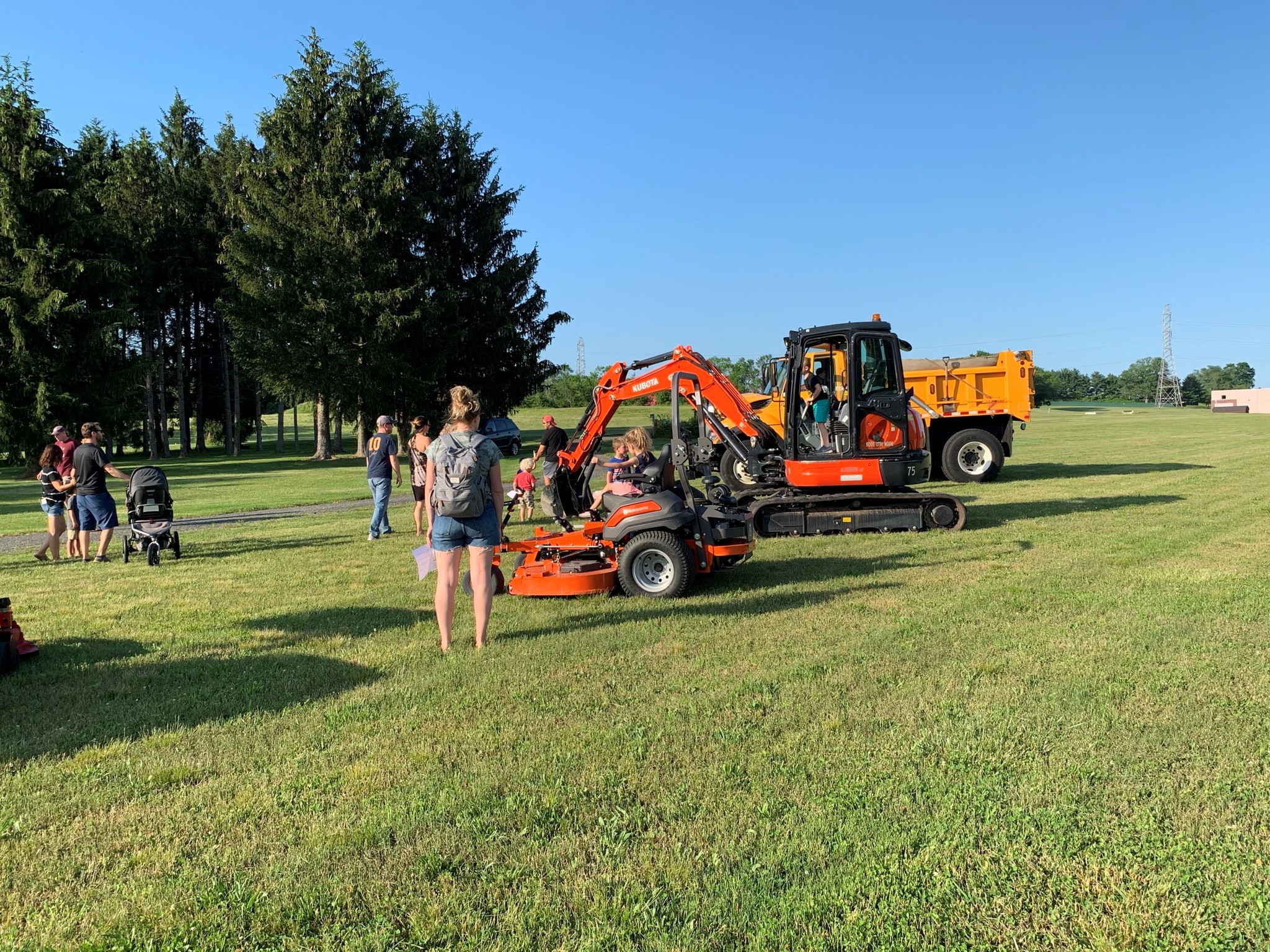 Kids in front of Public Works equipment
