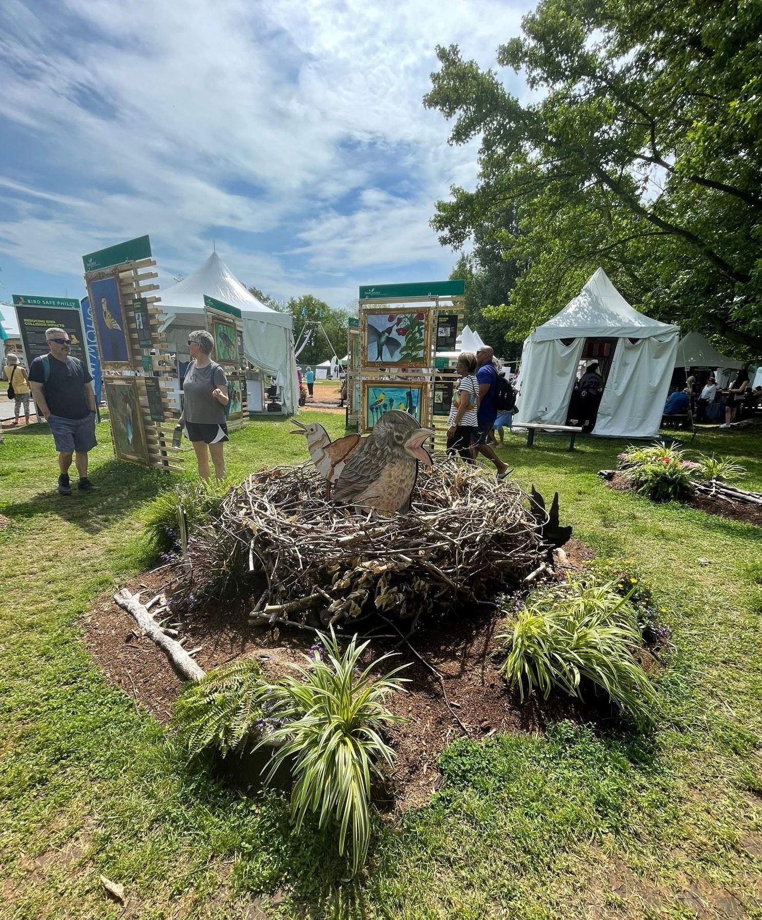 3 dimensional art of a bird in a nest made of sticks