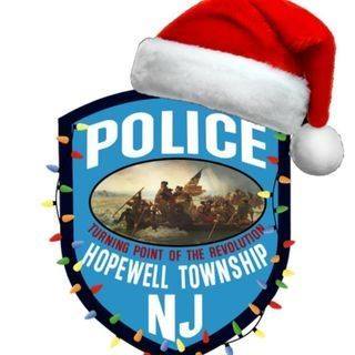Hopewell Twp police department patch with a santa hat and rainbow christmas lights