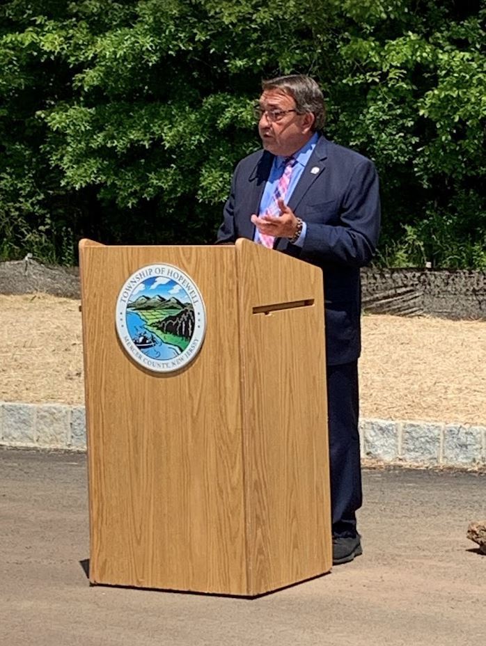 Sr Center announcement Assemblyman Anthony Verrelli behind dais making announcement