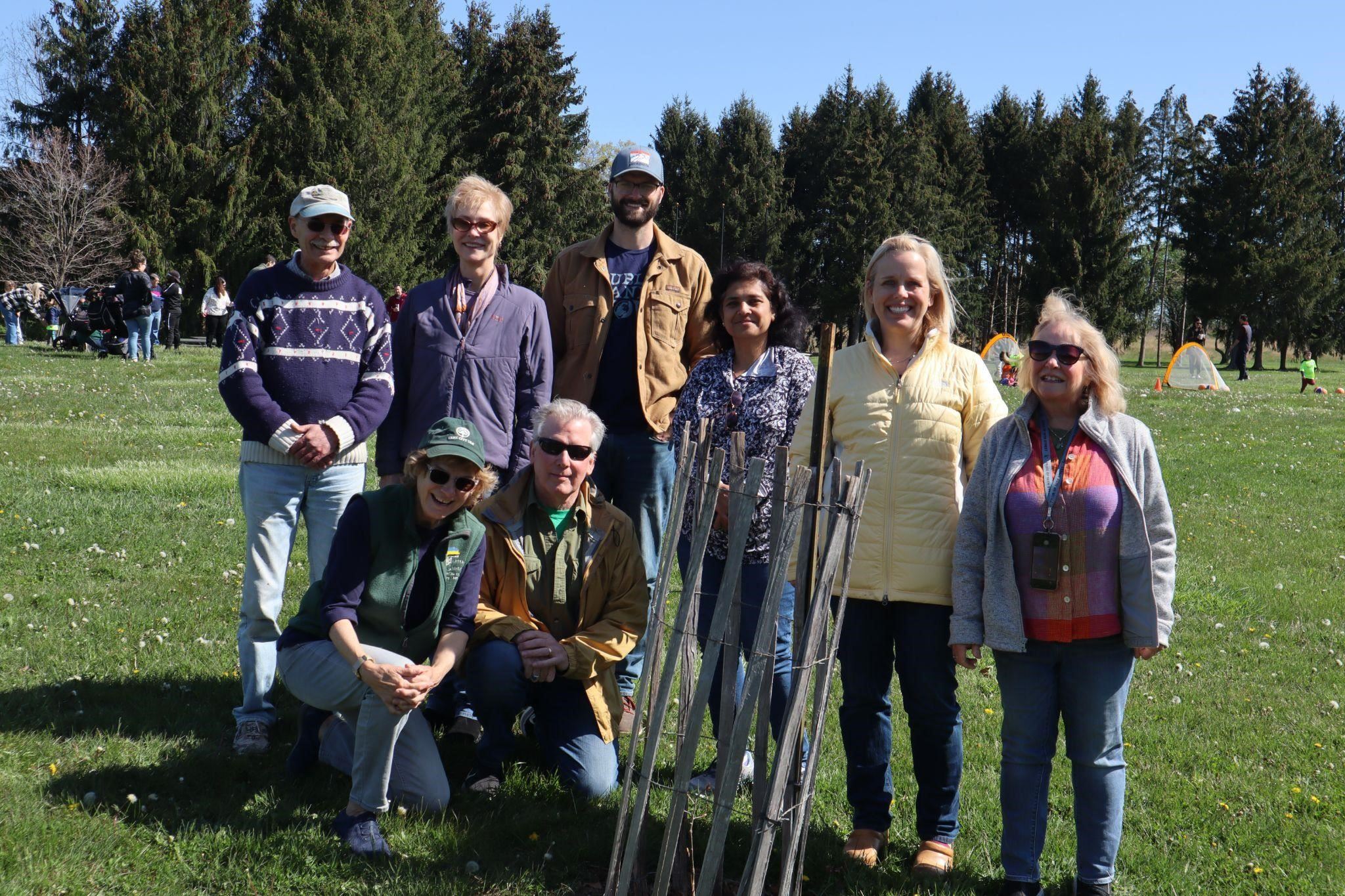 Salem Oak seedling with environmental commission team in the sun at Woolsey Park