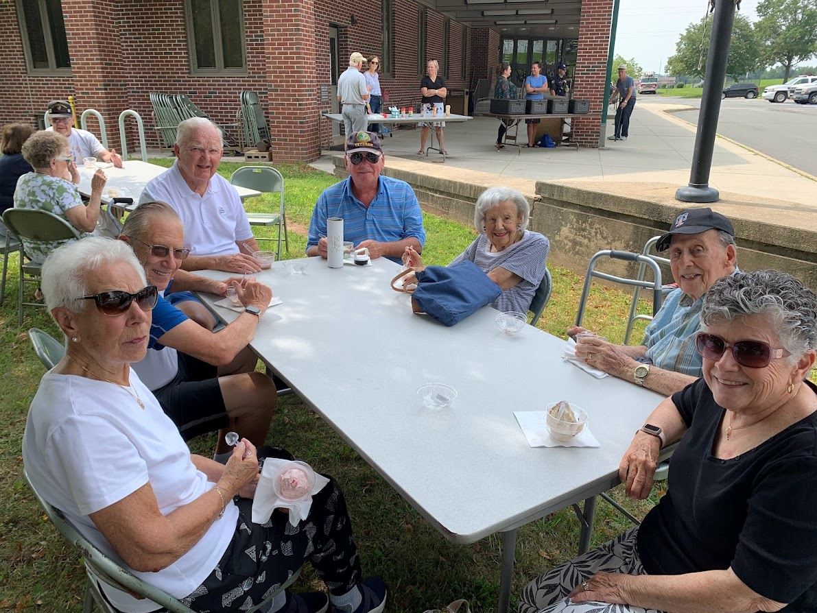 Seniors celebrating senior citizens day with ice cream