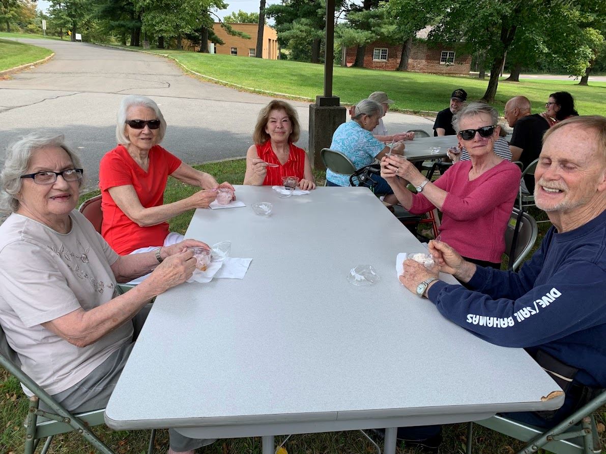 Seniors celebrating senior citizens day with ice cream