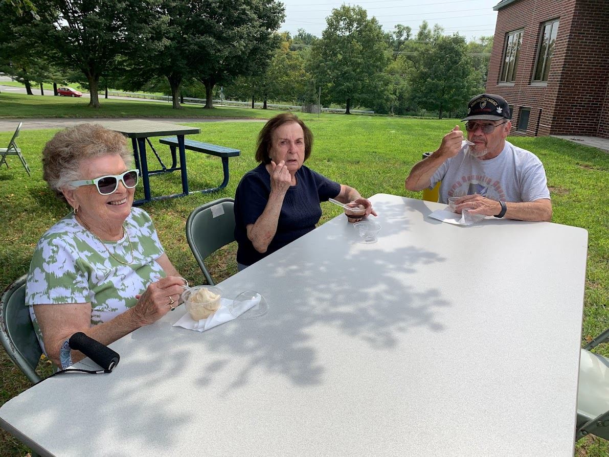 Seniors celebrating senior citizens day with ice cream