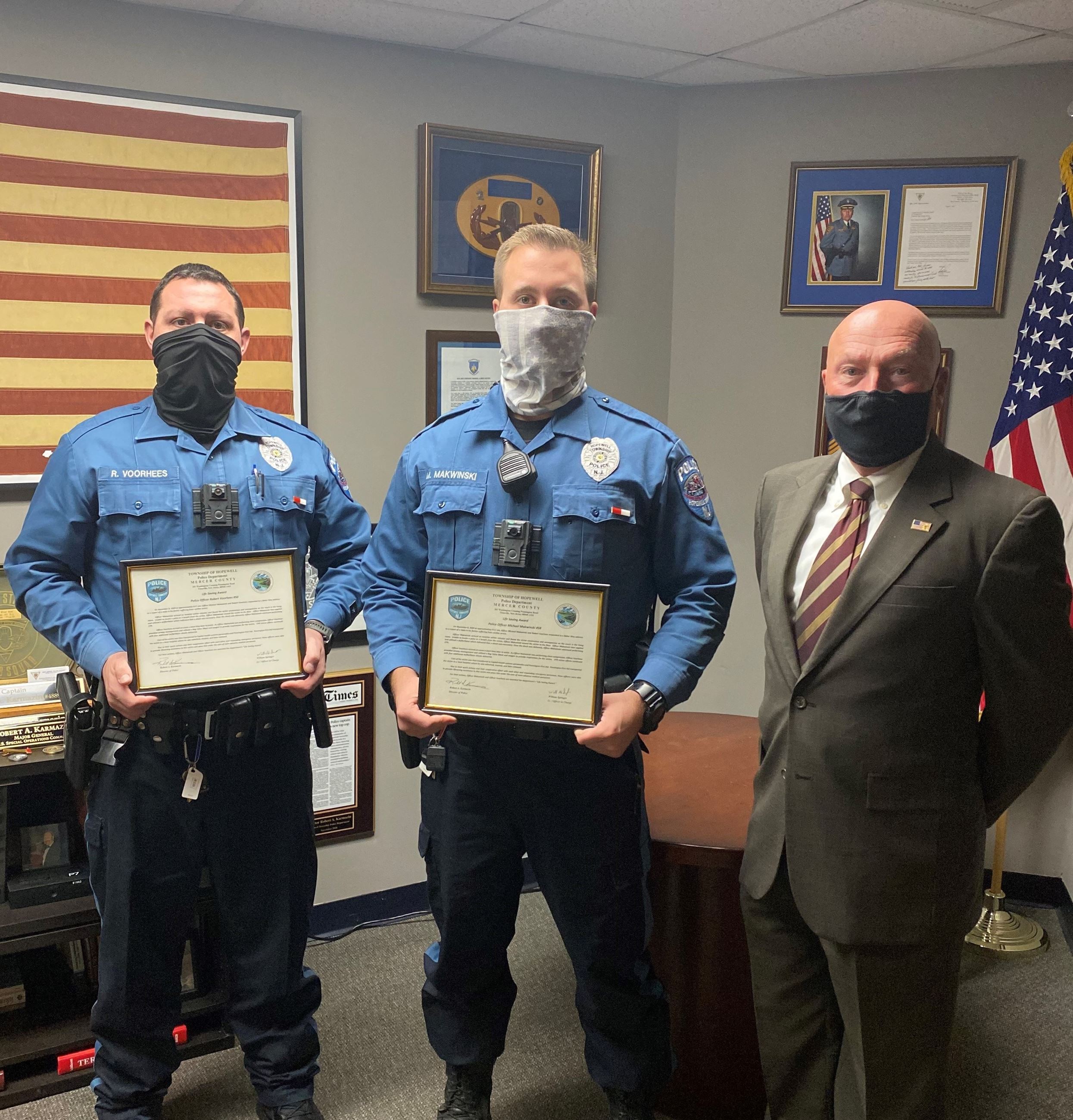 Life Saving Award Photo- Officers Voorhees and Makwinski receiving the award from Director Karmazin
